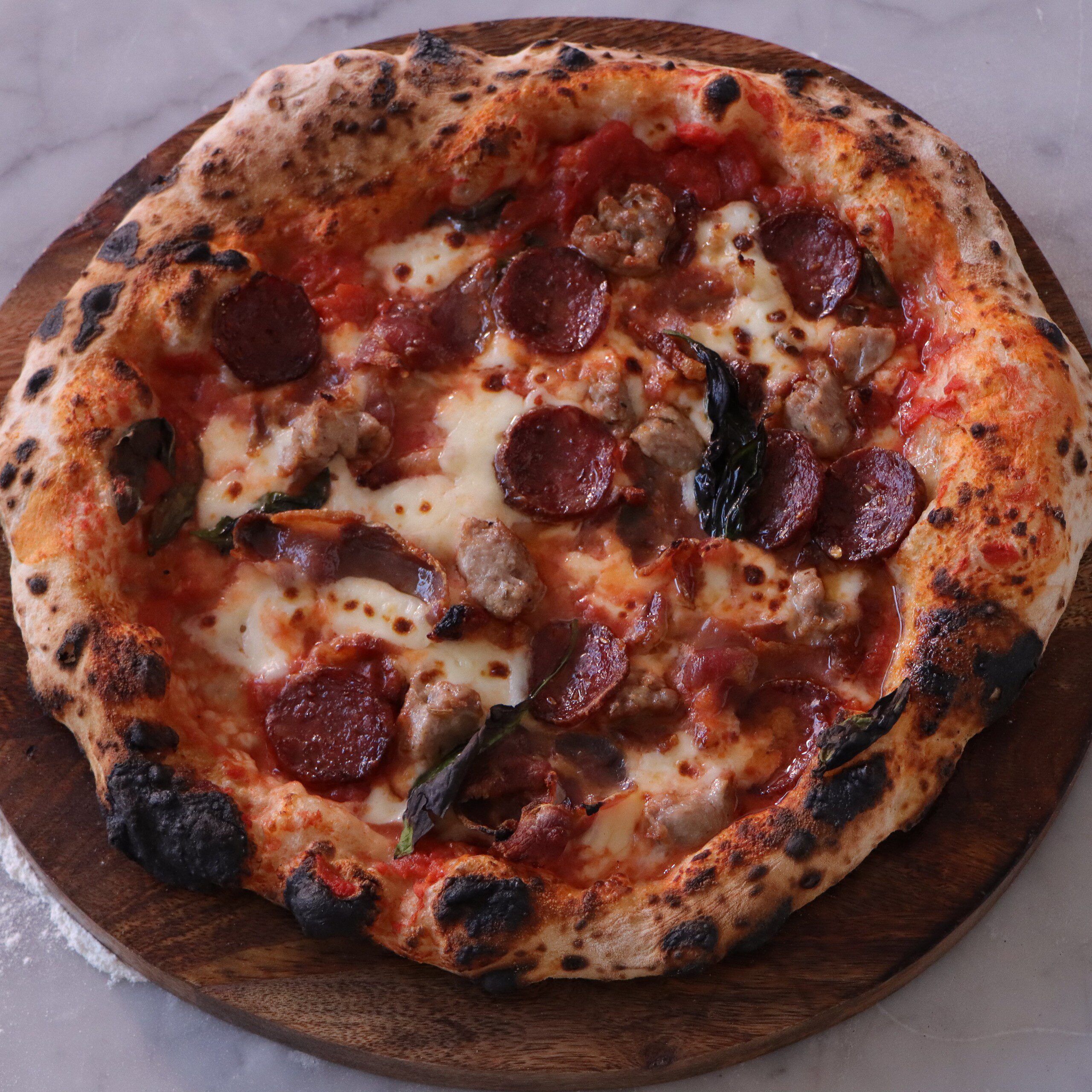 Crafting Authentic Meat Lovers Pizza: Italian Toppings & Neapolitan Base